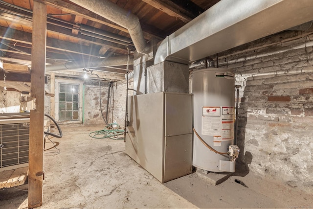 unfinished basement with water heater and heating unit