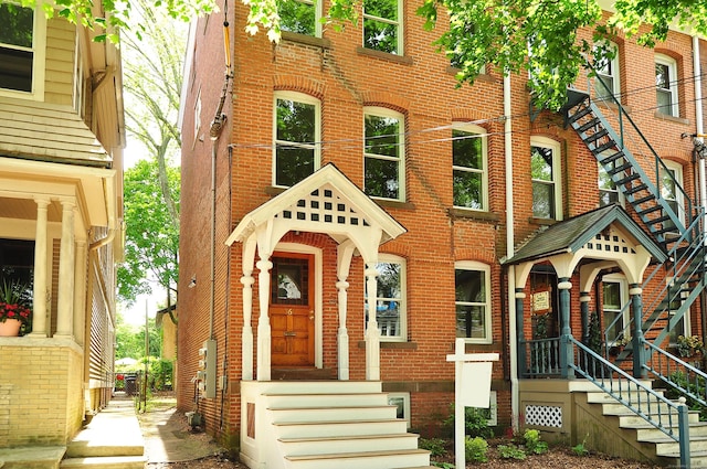 view of front of home featuring brick siding