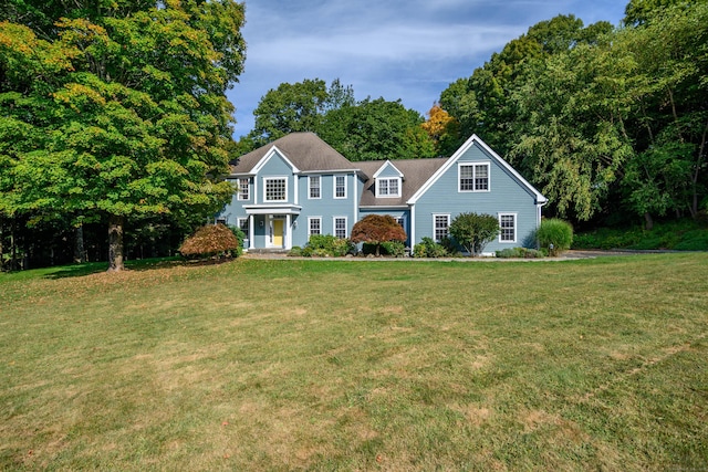 colonial home with a front lawn