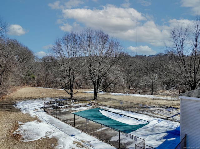 view of swimming pool with fence