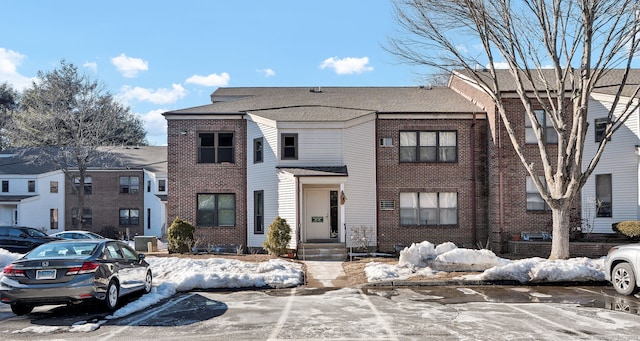 view of front of home featuring brick siding