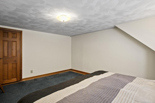 carpeted bedroom with baseboards