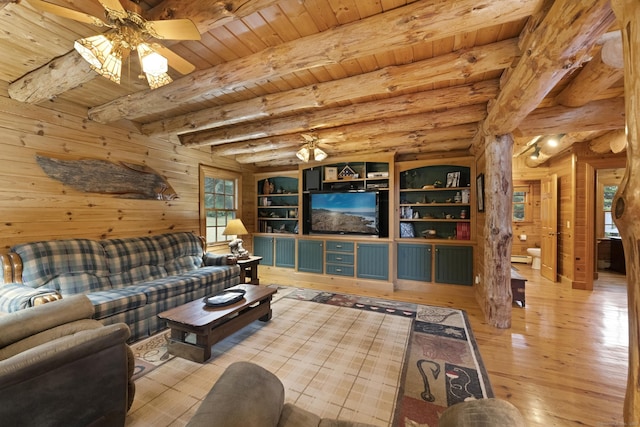 living area featuring wooden ceiling, ceiling fan, beam ceiling, and hardwood / wood-style flooring