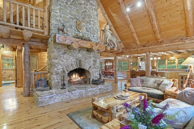 living room with high vaulted ceiling, a stone fireplace, hardwood / wood-style flooring, wood ceiling, and beam ceiling