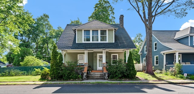11 Strong Ct, Plainville, CT 06062 - view of front of house featuring a porch and a chimney