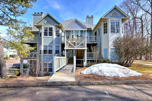 75 Redwood Dr Unit 510, East Haven, CT 06513 - view of front of home with stairs, a deck, and a chimney