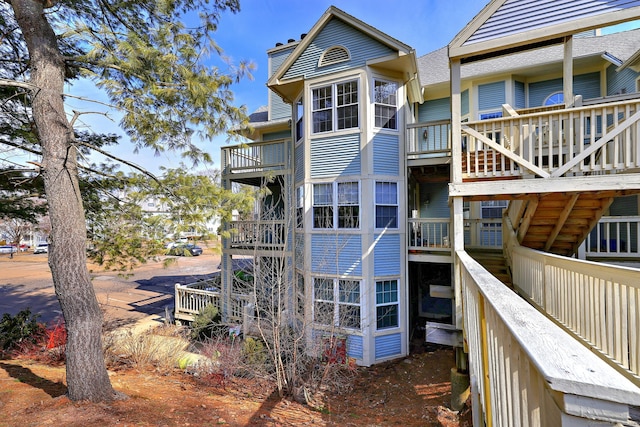 75 Redwood Dr Unit 510, East Haven, CT 06513 - back of house featuring a chimney and stairs