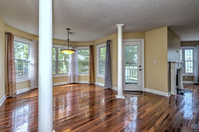 75 Redwood Dr Unit 510, East Haven, CT 06513 - interior space featuring a fireplace, visible vents, baseboards, wood-type flooring, and ornate columns
