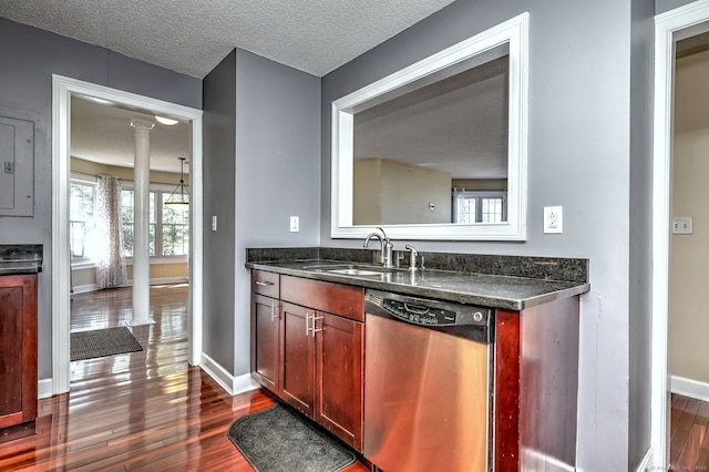 75 Redwood Dr Unit 510, East Haven, CT 06513 - kitchen with a textured ceiling, a sink, stainless steel dishwasher, dark wood finished floors, and decorative columns