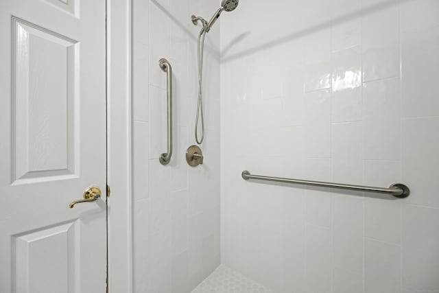 bathroom with tiled shower