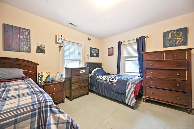 bedroom with visible vents