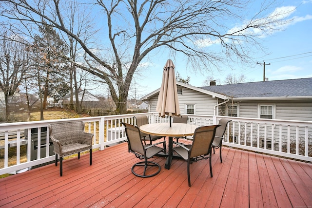 wooden deck with outdoor dining area