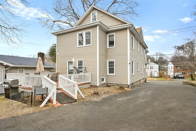 view of front of property with a wooden deck