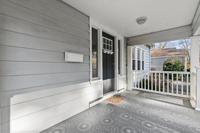 doorway to property featuring a porch