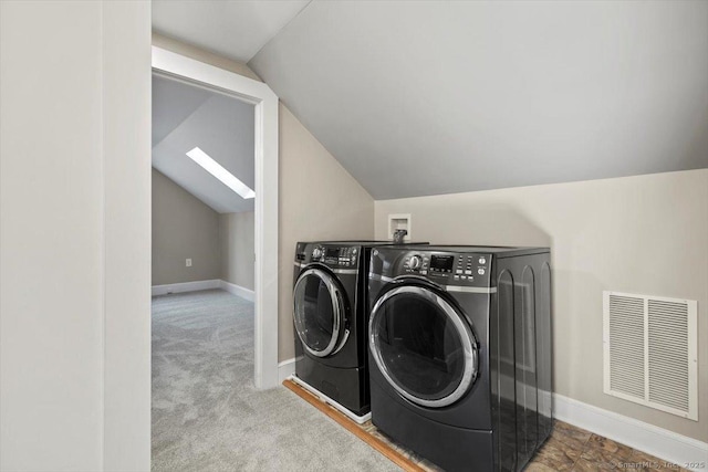 clothes washing area featuring laundry area, carpet flooring, visible vents, baseboards, and independent washer and dryer