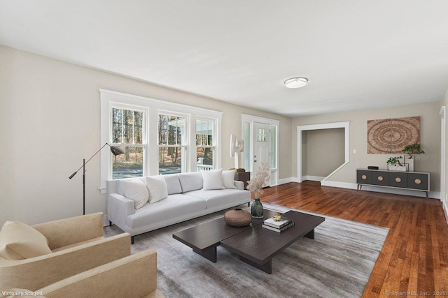 living area with wood finished floors and baseboards