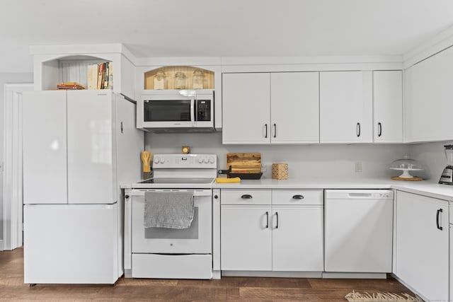 kitchen featuring white appliances, white cabinets, dark wood-style flooring, and light countertops