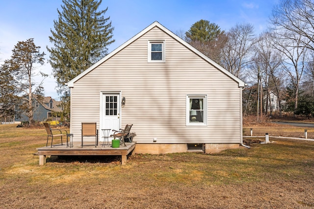 back of property with a lawn and a wooden deck