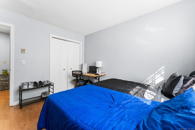 bedroom with a closet and wood finished floors