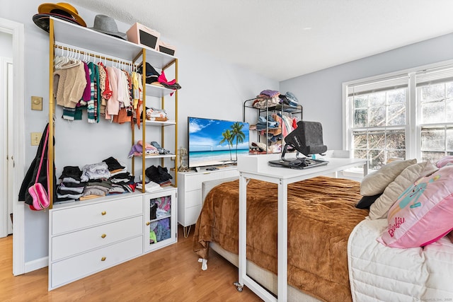 bedroom with light wood-style floors