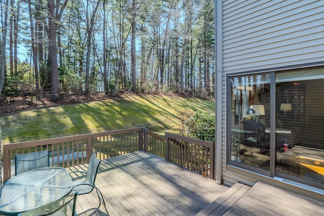 wooden deck with a yard