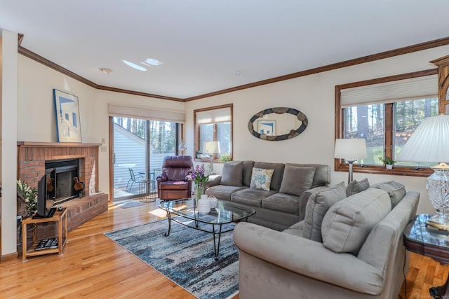 living room with a fireplace, light wood-type flooring, and ornamental molding