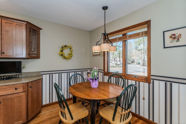 dining area featuring light wood-style floors