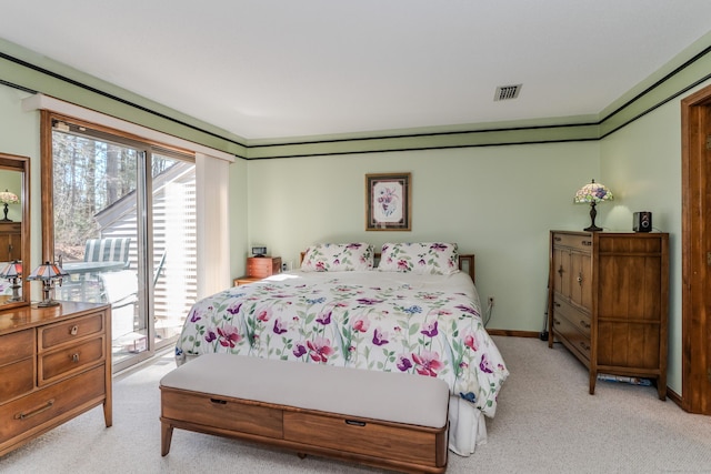 bedroom with access to exterior, light colored carpet, visible vents, and baseboards