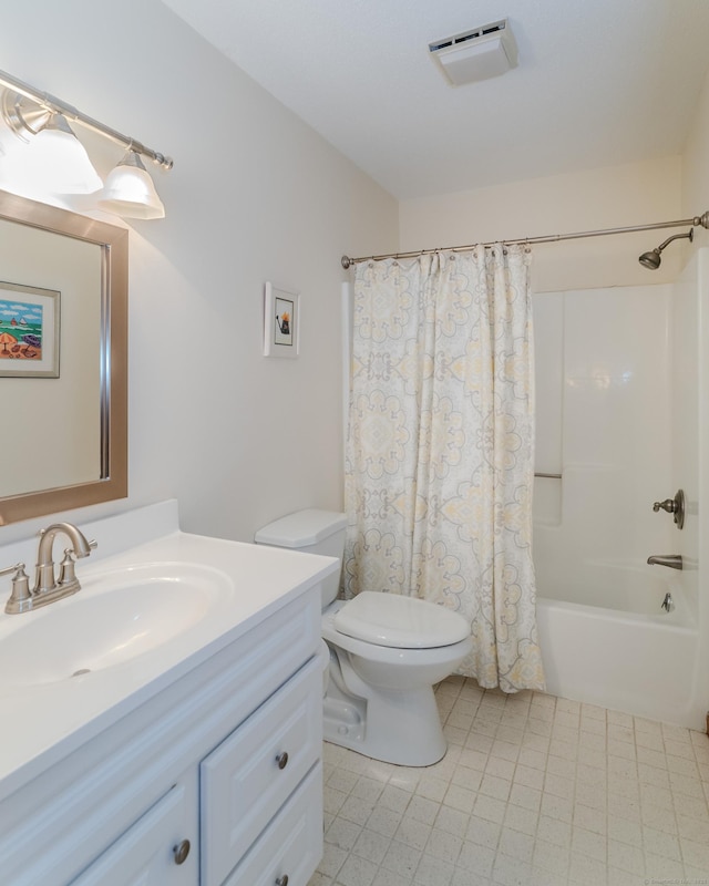 full bath featuring visible vents, toilet, vanity, and shower / bath combo