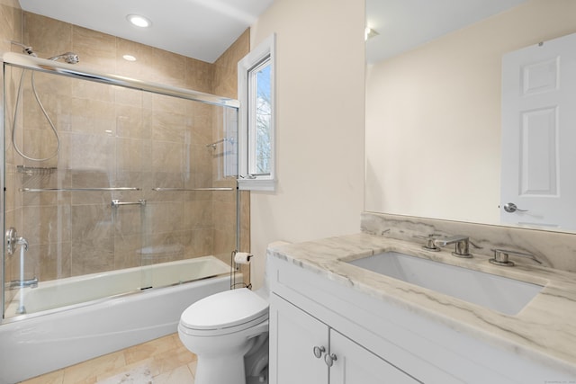 full bath with toilet, recessed lighting, combined bath / shower with glass door, and vanity