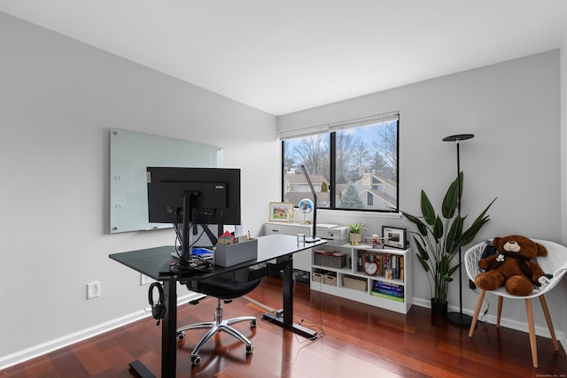 home office with baseboards and wood finished floors