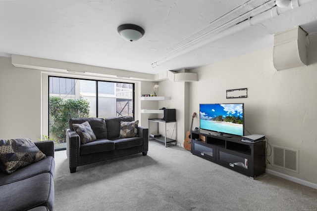 living area with carpet flooring and visible vents