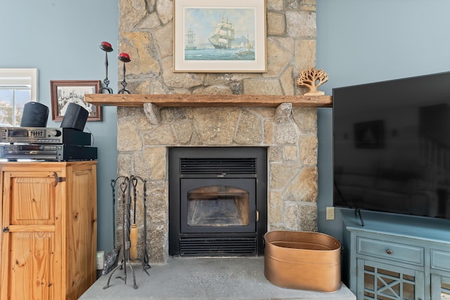 details featuring concrete floors and a fireplace