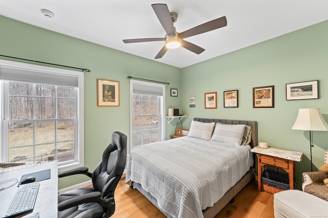 bedroom featuring ceiling fan and wood finished floors
