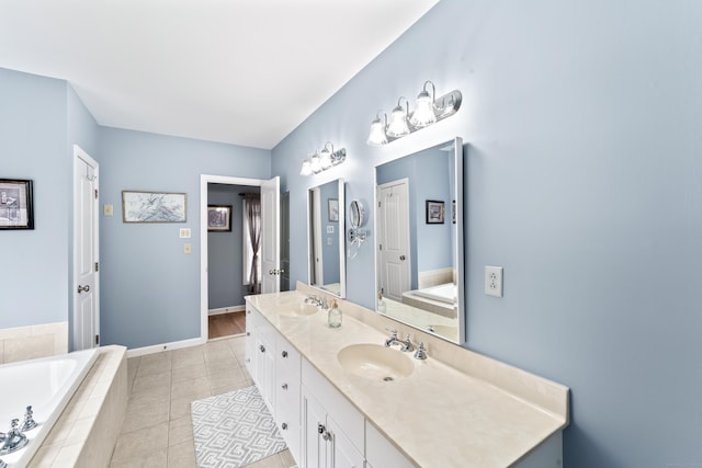 full bathroom featuring double vanity, a sink, a bath, and tile patterned flooring