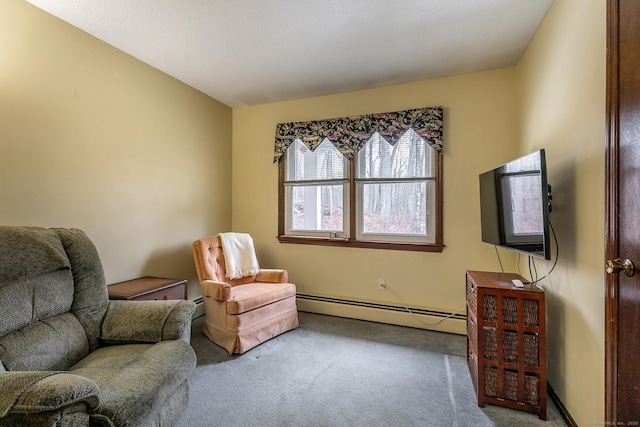 living area with a baseboard radiator, a baseboard heating unit, and carpet flooring