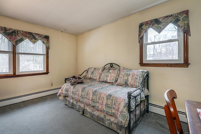 bedroom featuring a baseboard heating unit and carpet flooring