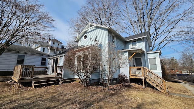 back of property featuring a deck