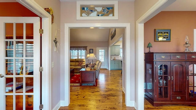 interior space featuring wood finished floors and baseboards