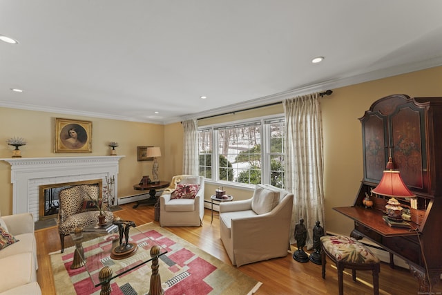 living room featuring crown molding, recessed lighting, a baseboard heating unit, a brick fireplace, and wood finished floors