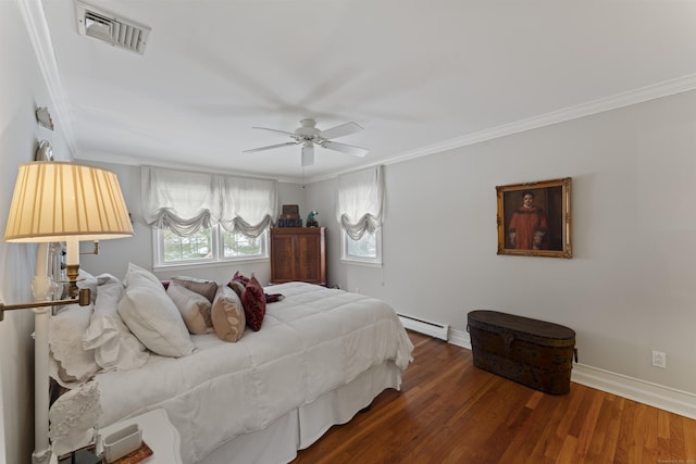 bedroom featuring a baseboard heating unit, visible vents, and crown molding