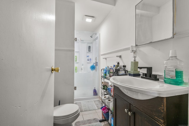 full bathroom featuring toilet, walk in shower, vanity, and tile patterned floors