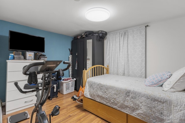 bedroom with light wood-style floors