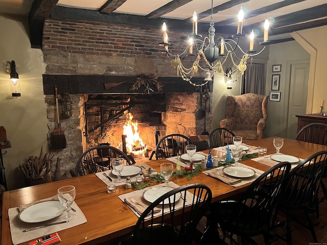 579 Taugwonk Rd, Stonington, CT 06378 - dining room featuring a chandelier and beamed ceiling