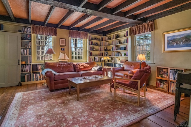 579 Taugwonk Rd, Stonington, CT 06378 - sitting room featuring wood-type flooring, beam ceiling, and built in shelves
