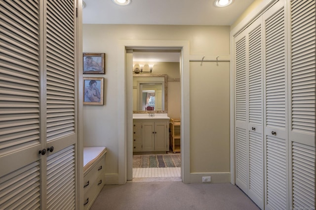 579 Taugwonk Rd, Stonington, CT 06378 - corridor with carpet and recessed lighting
