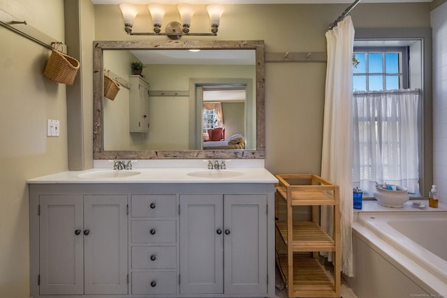 579 Taugwonk Rd, Stonington, CT 06378 - bathroom with a bath, double vanity, and connected bathroom