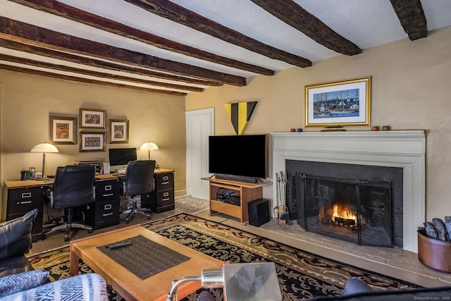579 Taugwonk Rd, Stonington, CT 06378 - living room with beam ceiling, a lit fireplace, and an office area