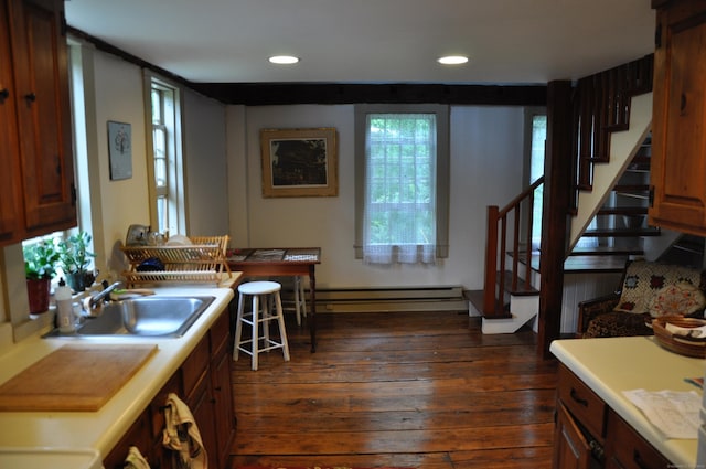 579 Taugwonk Rd, Stonington, CT 06378 - kitchen with a baseboard heating unit, light countertops, dark wood finished floors, recessed lighting, and brown cabinets