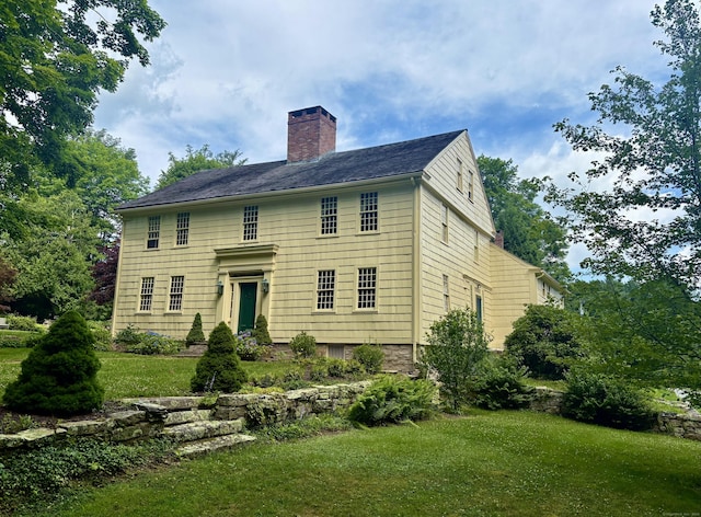 579 Taugwonk Rd, Stonington, CT 06378 - colonial inspired home featuring a chimney and a front lawn
